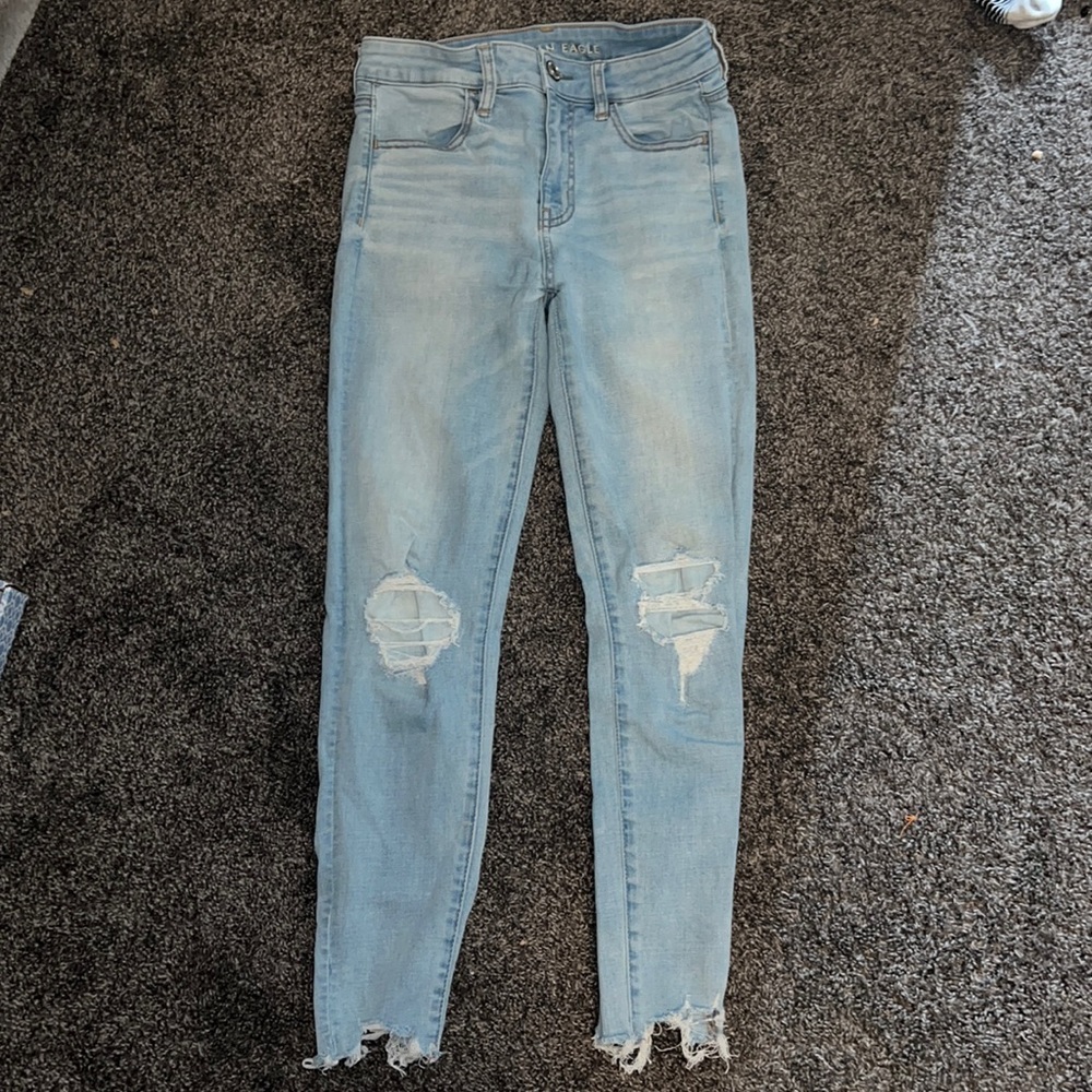 American Eagle Super stretch mid rise distressed light blue skinny jeans